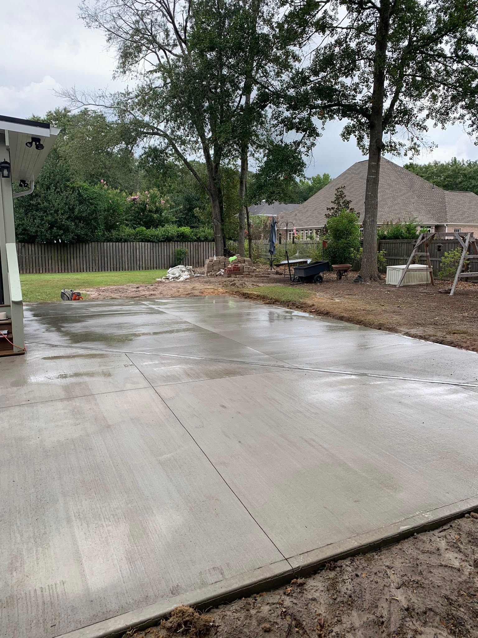 Finished concrete patio slab in a residential backyard